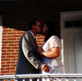 Randy kissing the bride <i>(note:  artsy fartsy heart shape in between them)</i>